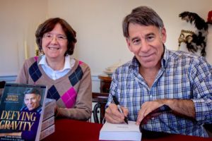 Stephen Schwartz signs books with author Carol de Giere